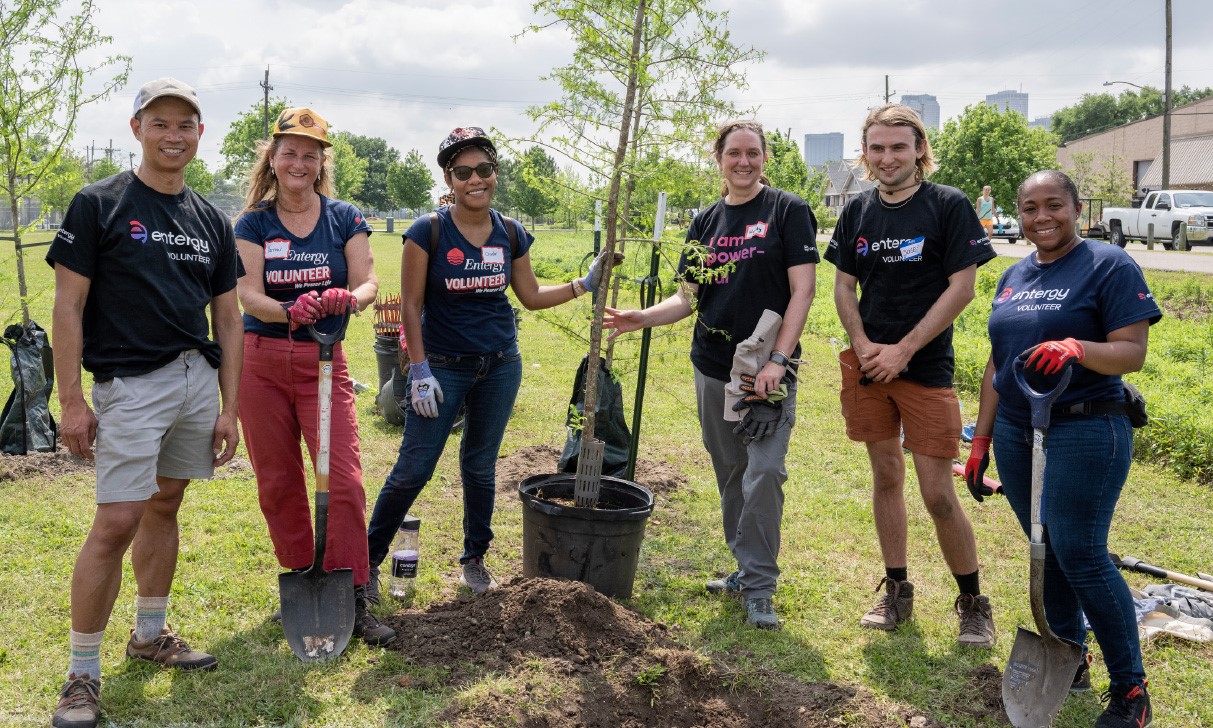 Entergy employee volunteers planting trees